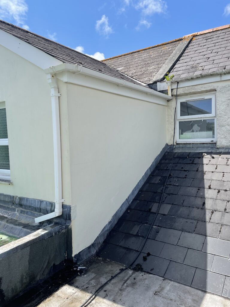 Gable end of a property clean after softwash treatment.
