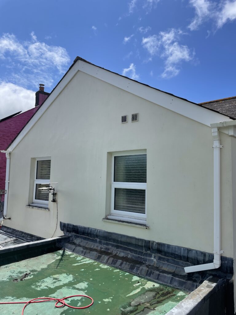 Gable end of a property clean after softwash treatment.