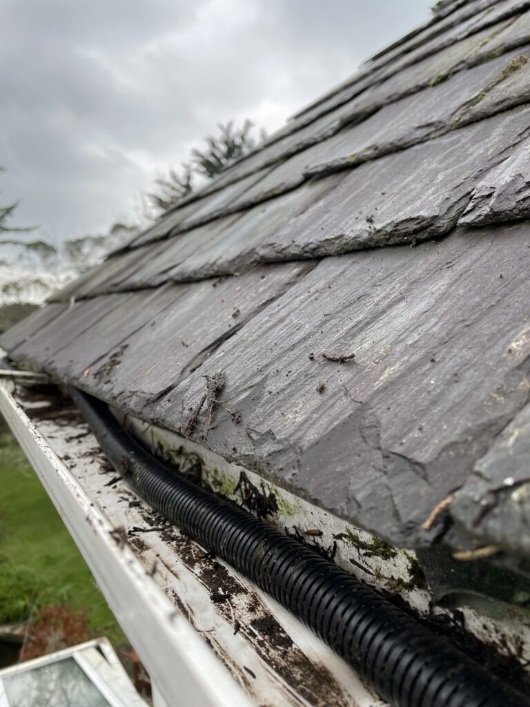 Awkward gutter clearing job with cable trunking