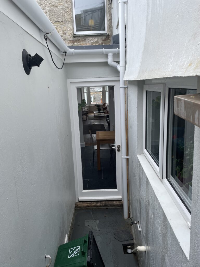 soft washing around the back of a narrow property