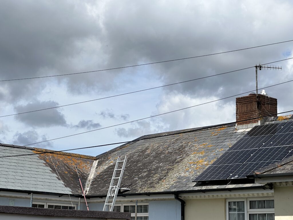 Corner of a roof before pressure washing