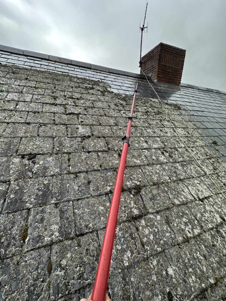 Action shot of me Pressure Washing a roof